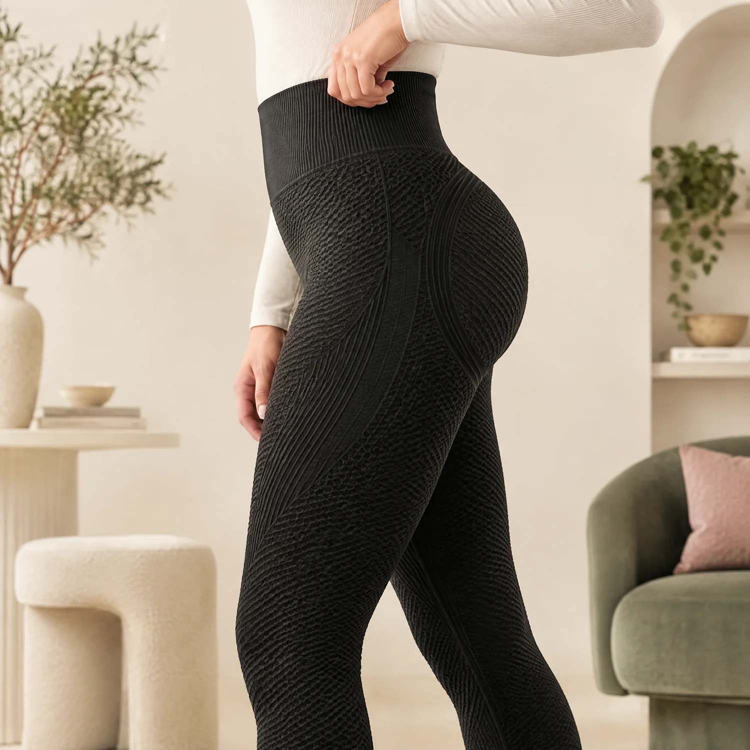 Side profile of the black leggings showing the lifted, sculpted silhouette